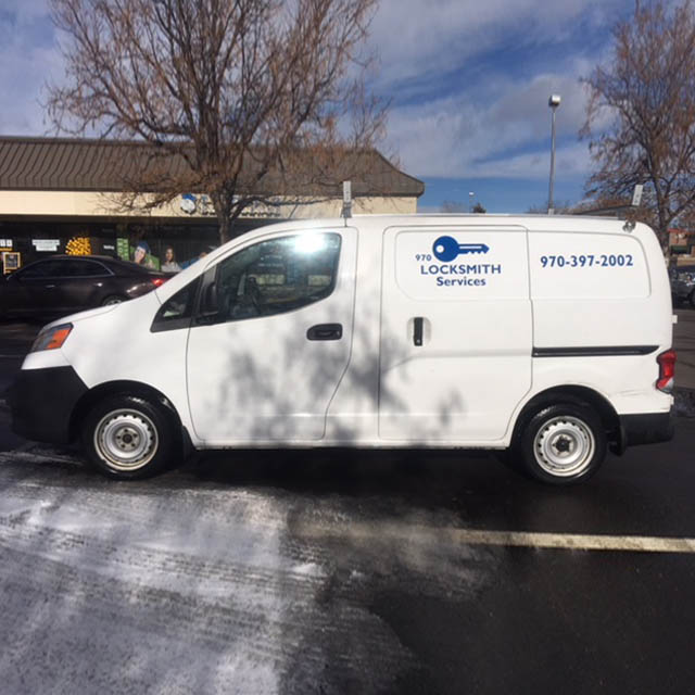 970 Locksmith Fort Collins branded service van — Owner Omer's marked Nissan NV200 displaying phone (970) 397-2002, Fort Collins CO